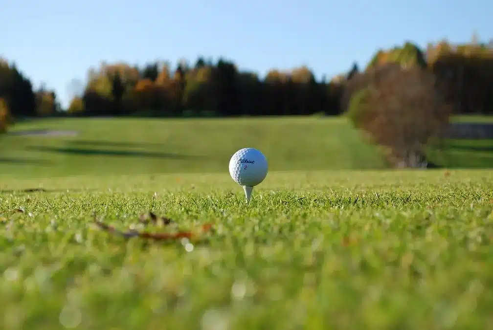 Golfing - a golf ball on the ground